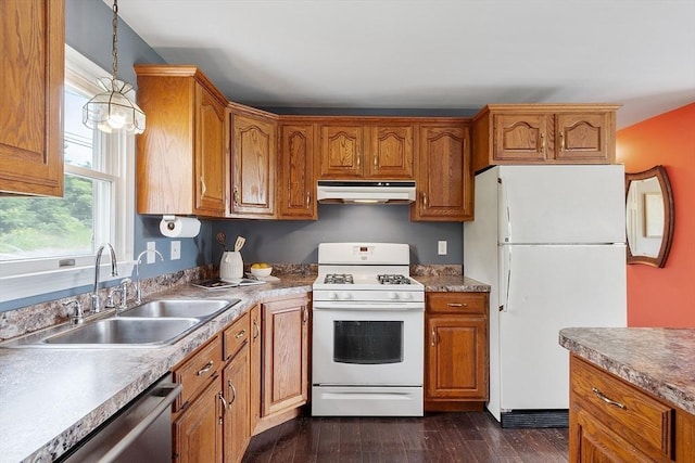 82 Powow St, Amesbury, MA 01913 - kitchen featuring white appliances, under cabinet range hood, dark wood-type flooring, and brown cabinets