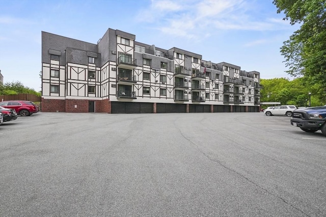 9 Broadway Unit 217, Saugus, MA 01906 - view of apartment building / complex with uncovered parking