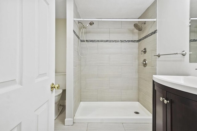 9 Broadway Unit 217, Saugus, MA 01906 - bathroom with vanity, toilet, and a tile shower