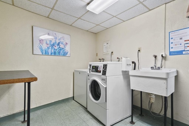 9 Broadway Unit 217, Saugus, MA 01906 - community laundry with washing machine and clothes dryer, baseboards, and light flooring