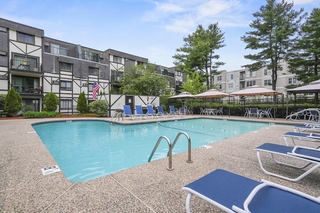 9 Broadway Unit 217, Saugus, MA 01906 - community pool featuring a patio and a residential view