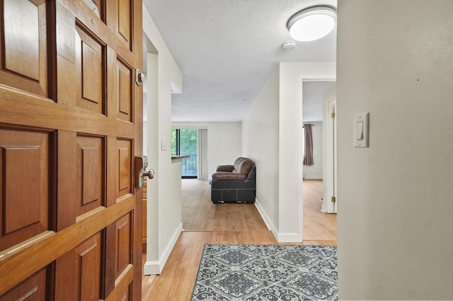 9 Broadway Unit 217, Saugus, MA 01906 - entrance foyer with light wood-style floors and baseboards