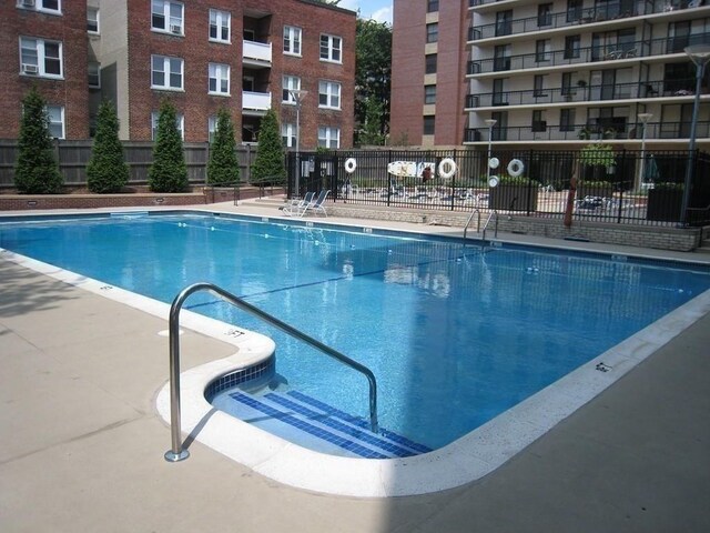 view of pool with fence