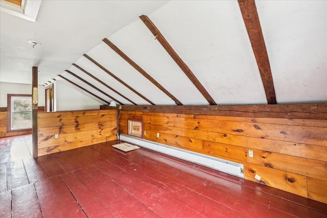 additional living space featuring wood walls, a baseboard heating unit, hardwood / wood-style flooring, and lofted ceiling