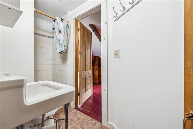 bathroom featuring tile patterned flooring and curtained shower