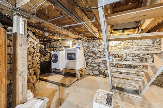 unfinished below grade area with washing machine and dryer