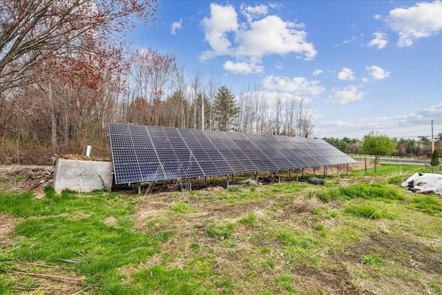 view of side of property featuring solar panels