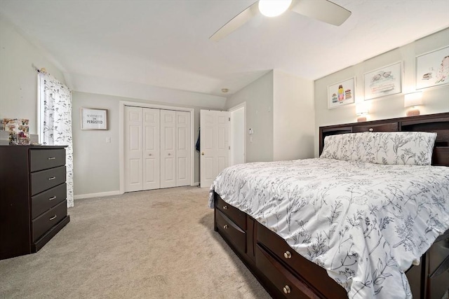 carpeted bedroom with a closet and ceiling fan