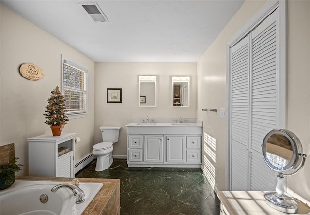 full bath with visible vents, toilet, a sink, a baseboard heating unit, and a closet