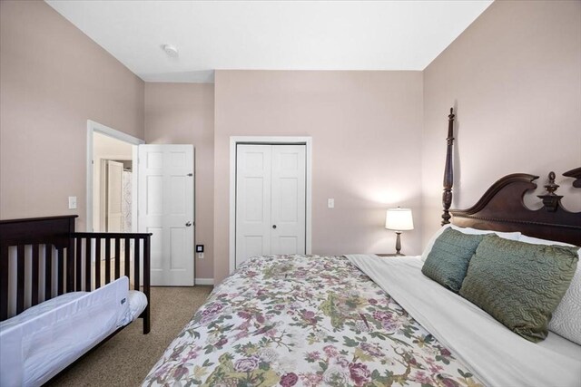 carpeted bedroom with a closet