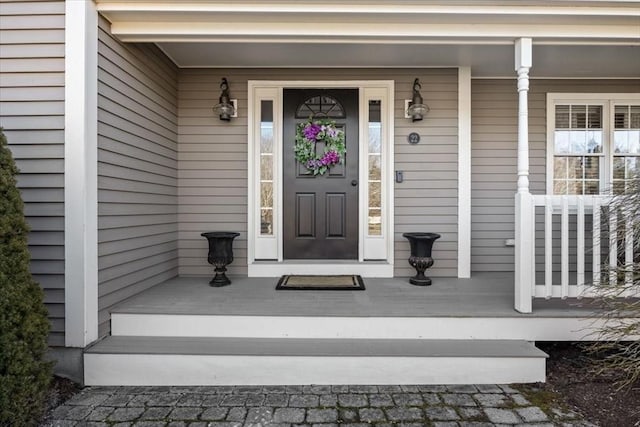 property entrance featuring covered porch