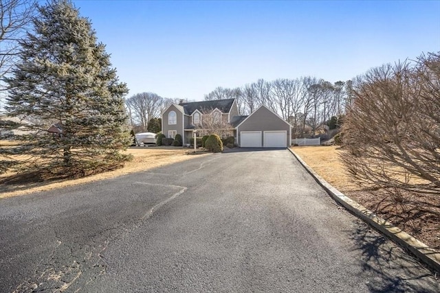 view of front of home with driveway and an attached garage