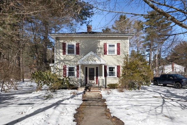 view of front of home with a chimney