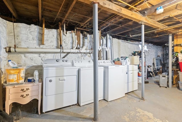 unfinished basement with independent washer and dryer