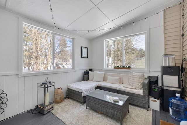 interior space with hardwood / wood-style flooring, vaulted ceiling, and a wealth of natural light