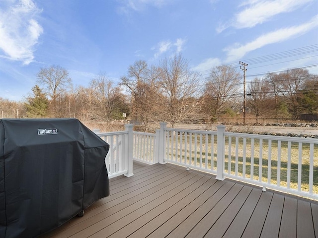 wooden deck featuring grilling area