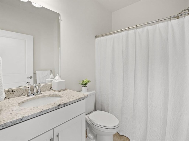 bathroom with toilet and vanity