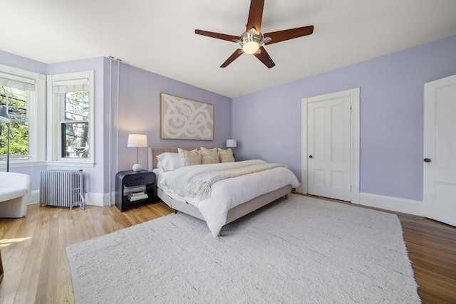 1 Murdock Ter, Boston, MA 02135 - bedroom featuring radiator, wood finished floors, and ceiling fan