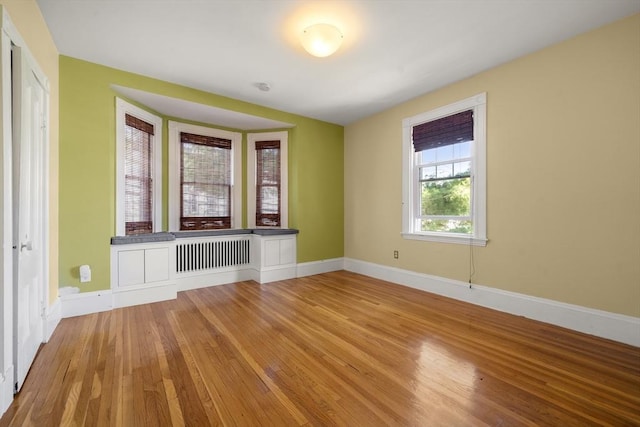 1 Murdock Ter, Boston, MA 02135 - unfurnished room featuring wood-type flooring and radiator