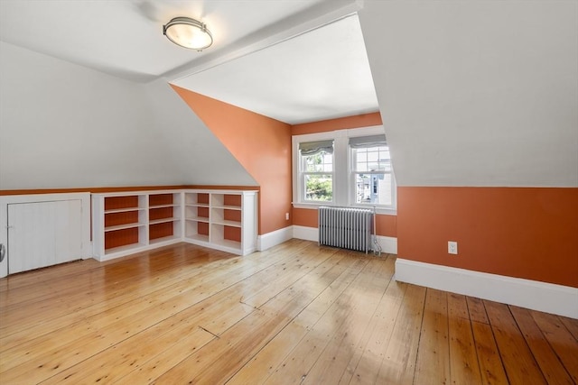 1 Murdock Ter, Boston, MA 02135 - additional living space with radiator, hardwood / wood-style flooring, and vaulted ceiling