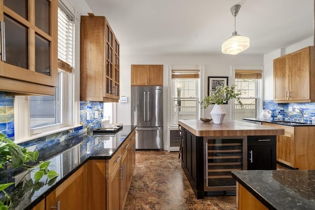 1 Murdock Ter, Boston, MA 02135 - kitchen featuring high quality fridge, beverage cooler, backsplash, butcher block countertops, and hanging light fixtures