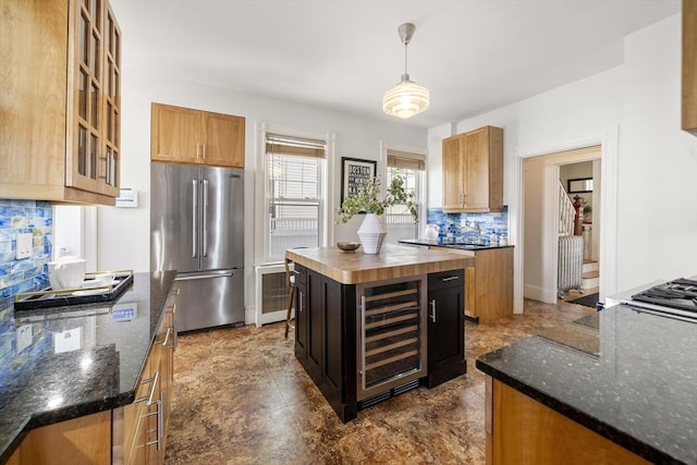 1 Murdock Ter, Boston, MA 02135 - kitchen with high end refrigerator, beverage cooler, decorative backsplash, glass insert cabinets, and a kitchen island