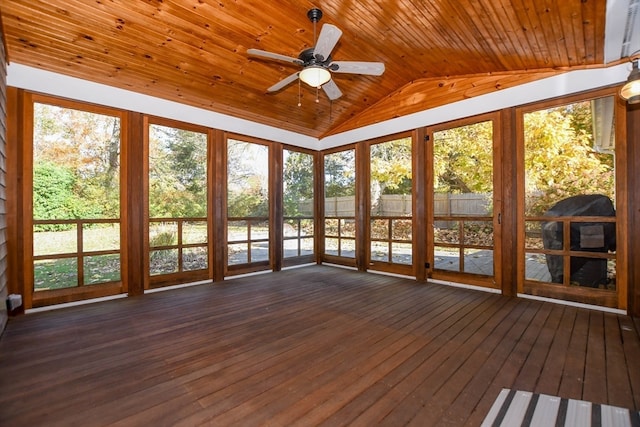 unfurnished sunroom with a wealth of natural light, lofted ceiling, wooden ceiling, and ceiling fan