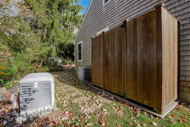 view of side of home featuring central air condition unit