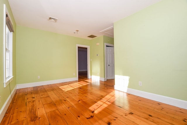 spare room featuring hardwood / wood-style flooring