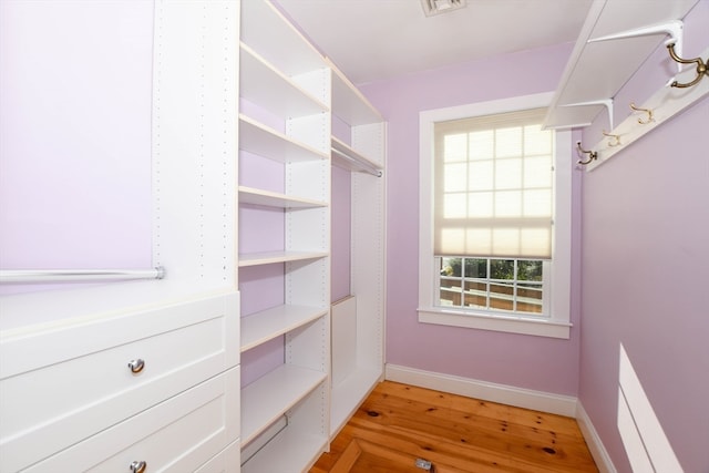 spacious closet featuring light wood-type flooring