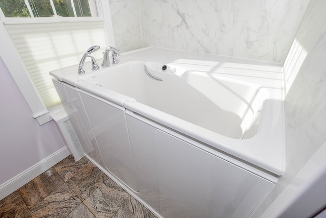 bathroom featuring a washtub