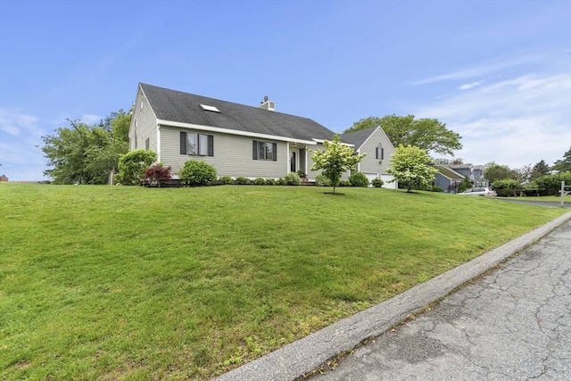 23 Mulholland Dr, Ipswich, MA 01938 - ranch-style house with a front yard and a chimney
