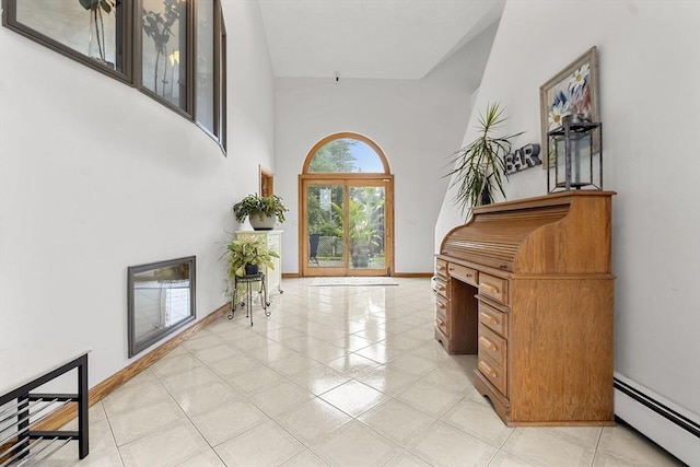 23 Mulholland Dr, Ipswich, MA 01938 - foyer entrance with a baseboard heating unit and a high ceiling