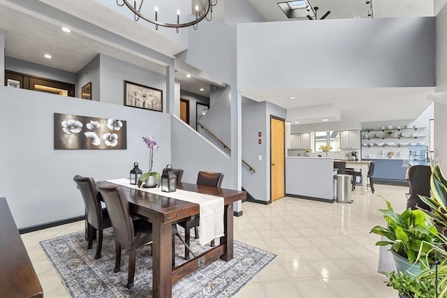 23 Mulholland Dr, Ipswich, MA 01938 - dining room featuring a towering ceiling, recessed lighting, a chandelier, and stairway