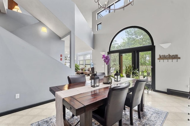 23 Mulholland Dr, Ipswich, MA 01938 - dining area featuring a high ceiling and a chandelier