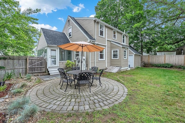 72 Marlboro St, Dedham, MA 02026 - rear view of house with entry steps, a fenced backyard, and a patio