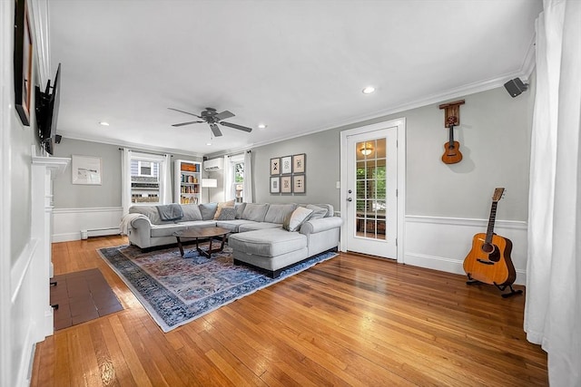 72 Marlboro St, Dedham, MA 02026 - living area with a baseboard radiator, hardwood / wood-style flooring, crown molding, a ceiling fan, and recessed lighting