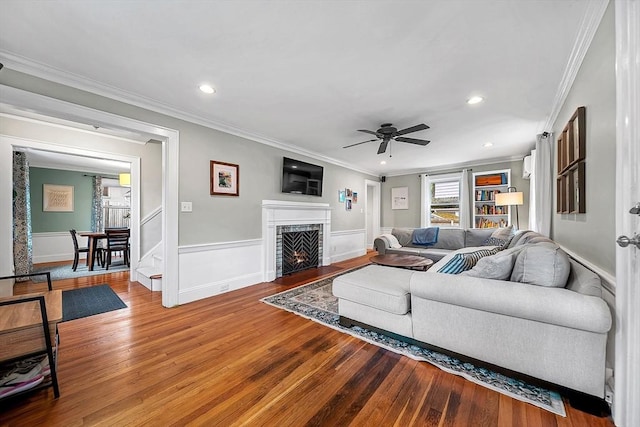 72 Marlboro St, Dedham, MA 02026 - living room featuring wood finished floors, a ceiling fan, crown molding, recessed lighting, and a fireplace with flush hearth