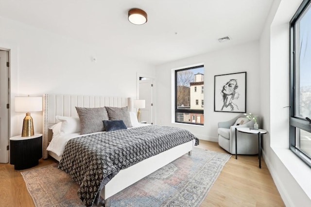 236-256 Dorchester St Unit 201, Boston, MA 02127 - bedroom featuring multiple windows and light wood-style flooring