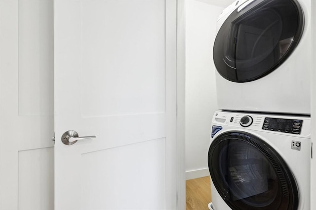 236-256 Dorchester St Unit 201, Boston, MA 02127 - laundry room with estacked washer and dryer and light wood-style flooring