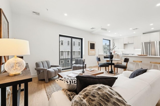236-256 Dorchester St Unit 201, Boston, MA 02127 - living area with light wood finished floors and recessed lighting