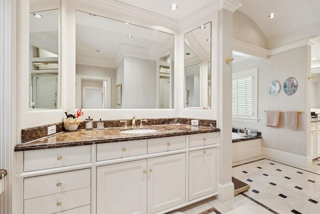 135 Marsh St, Belmont, MA 02478 - bathroom featuring crown molding, vanity, baseboards, and a bath