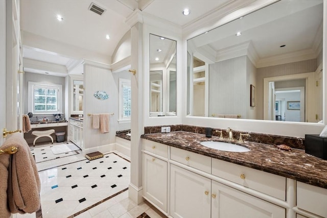 135 Marsh St, Belmont, MA 02478 - bathroom featuring tile patterned flooring, vanity, visible vents, ornamental molding, and a garden tub