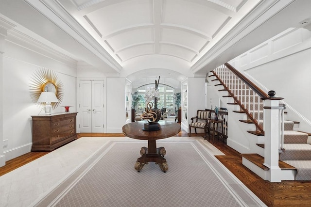 135 Marsh St, Belmont, MA 02478 - entryway with baseboards, stairs, lofted ceiling, and wood finished floors