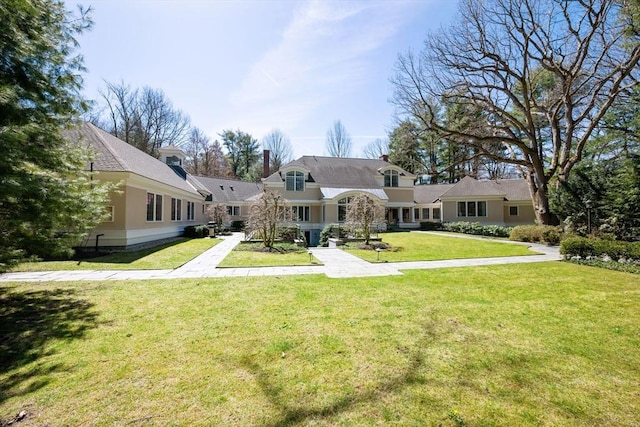 135 Marsh St, Belmont, MA 02478 - view of front of property featuring a front yard