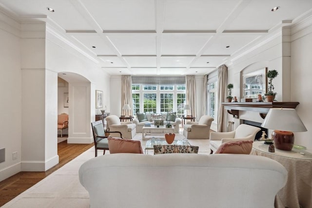 135 Marsh St, Belmont, MA 02478 - living area with wood finished floors, baseboards, recessed lighting, arched walkways, and coffered ceiling