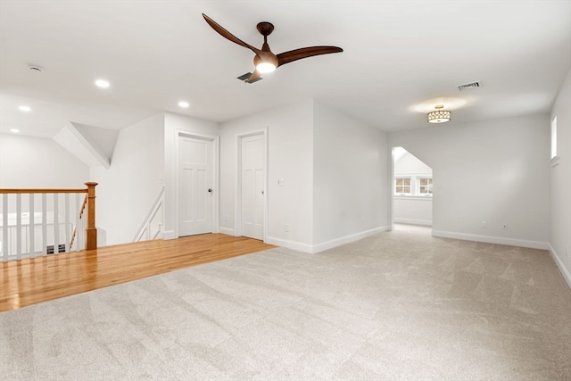 unfurnished room with carpet flooring and ceiling fan