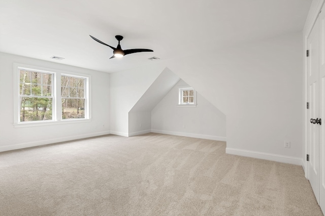 bonus room featuring vaulted ceiling, ceiling fan, and light colored carpet