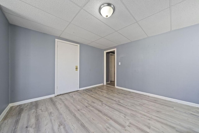 48 Rocliffe St, Fall River, MA 02723 - empty room featuring wood finished floors, a paneled ceiling, and baseboards