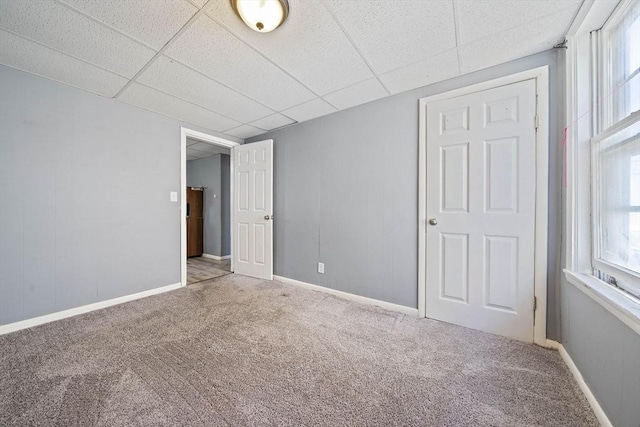 48 Rocliffe St, Fall River, MA 02723 - unfurnished bedroom featuring carpet floors, a paneled ceiling, and baseboards